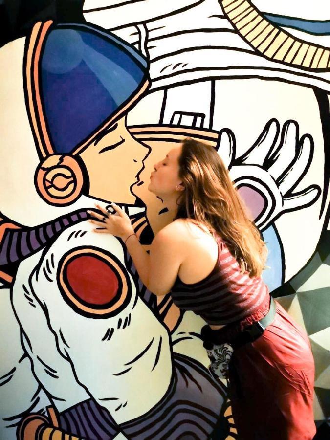 Stellar Capsules Hostel Семиняк Екстериор снимка Artist working on a mural